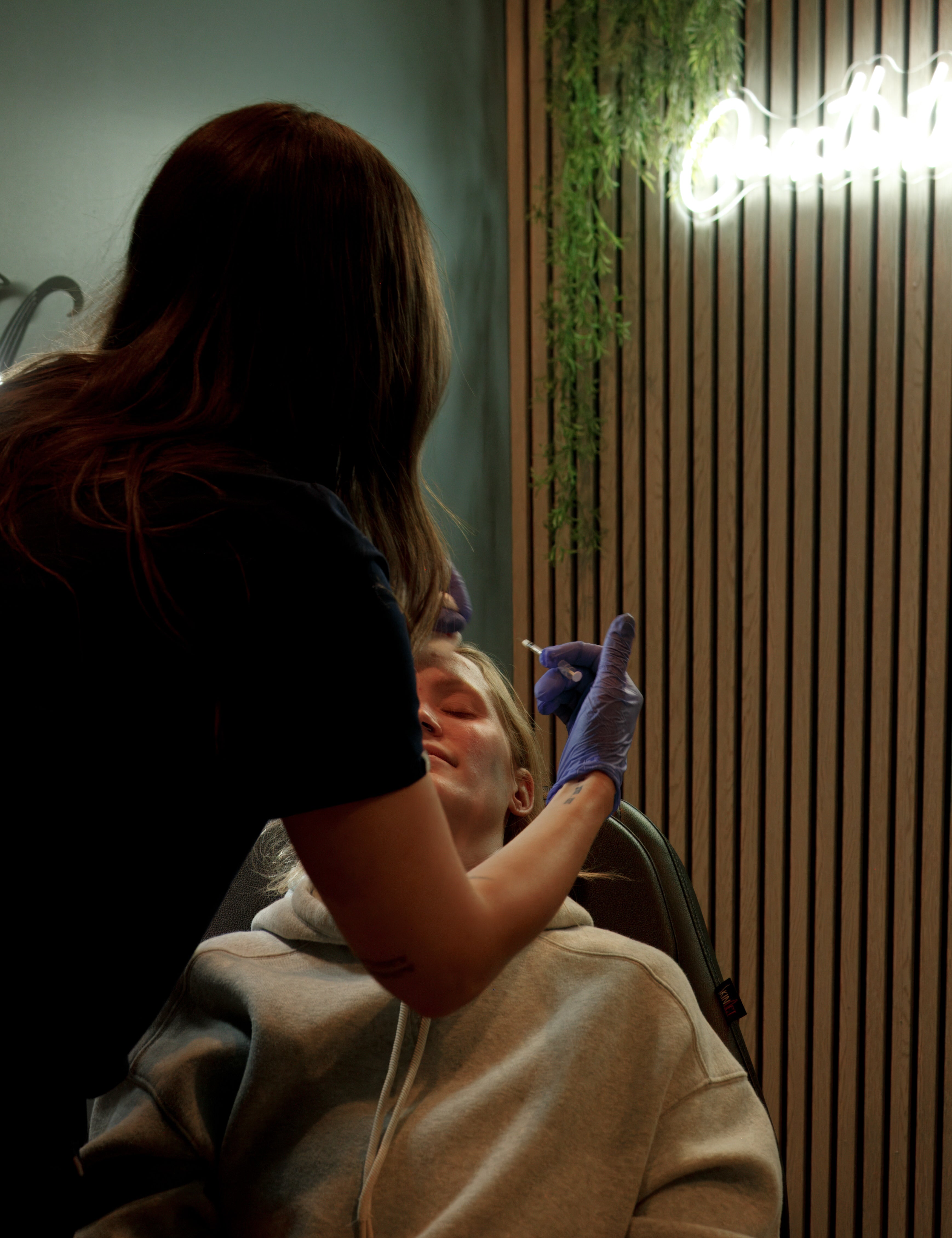 Person receiving a facial treatment in a spa setting.